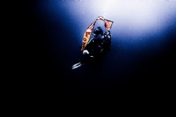 Diver preparing an inflatable beacon during stormy (low v... by Zaid Al Sager 